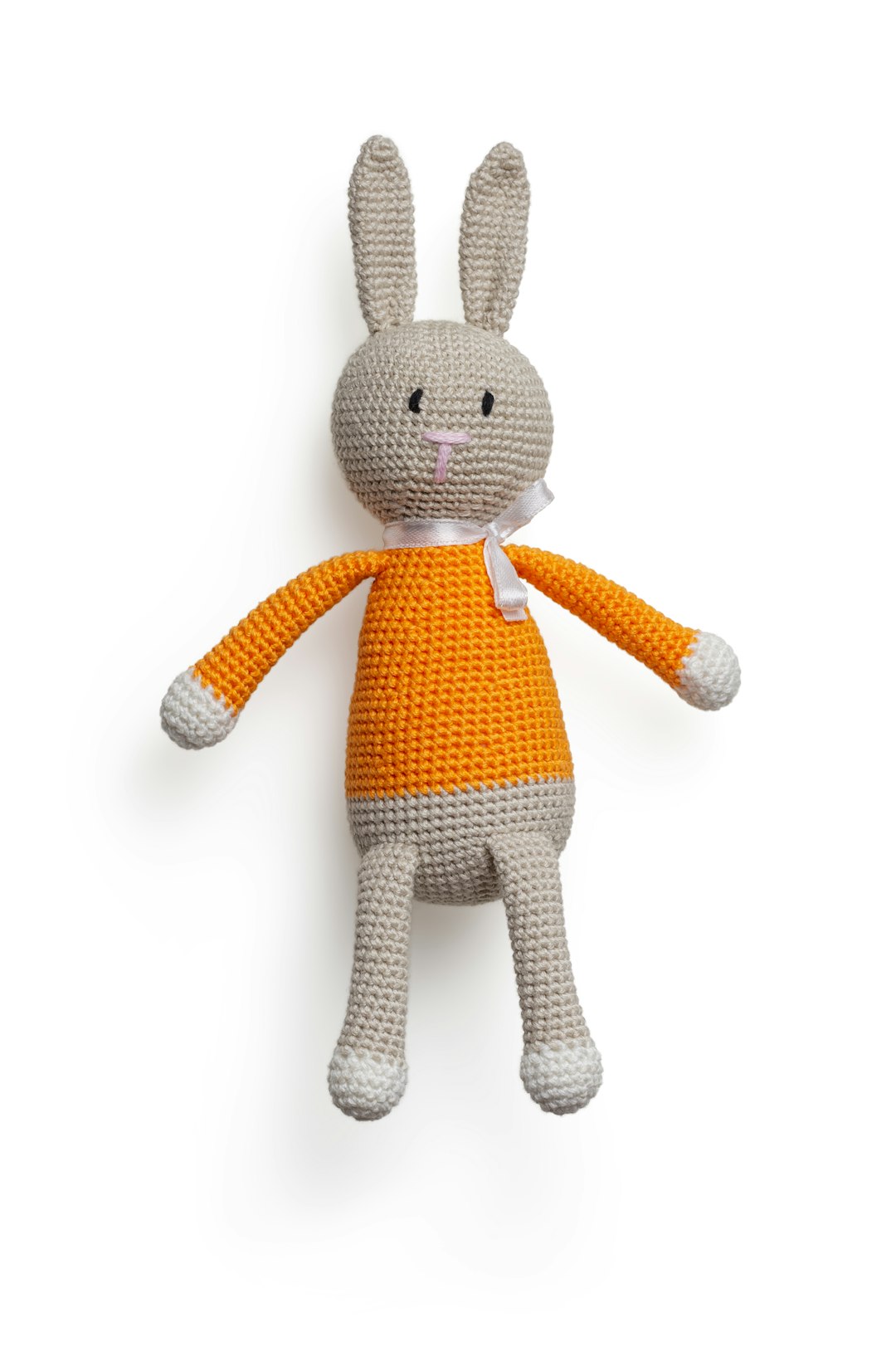 Isolated handmade rabbit children toy on white background